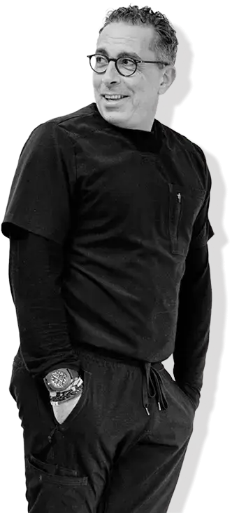 A white and black picture from Dr. Mansour, Orthodontist.